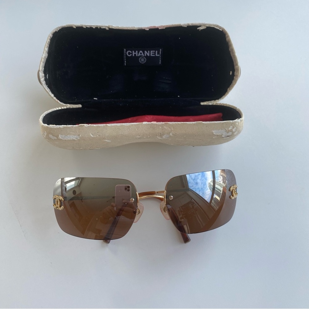 Chanel Brown Rimless Sunglasses with Modern Wrap-Around Design